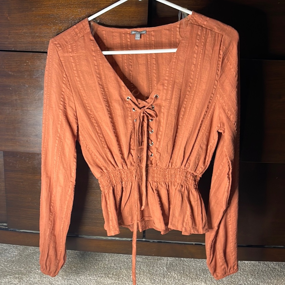 Burnt orange long sleeve blouse from Charlotte Russe